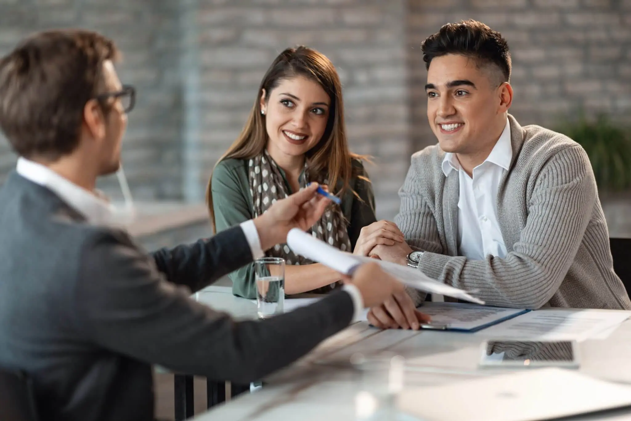 Business meeting with smiling clients
