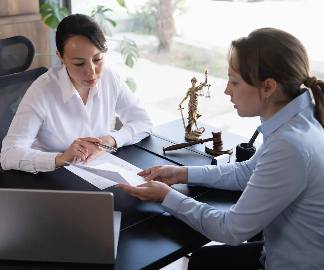 Women reviewing paperwork in an office