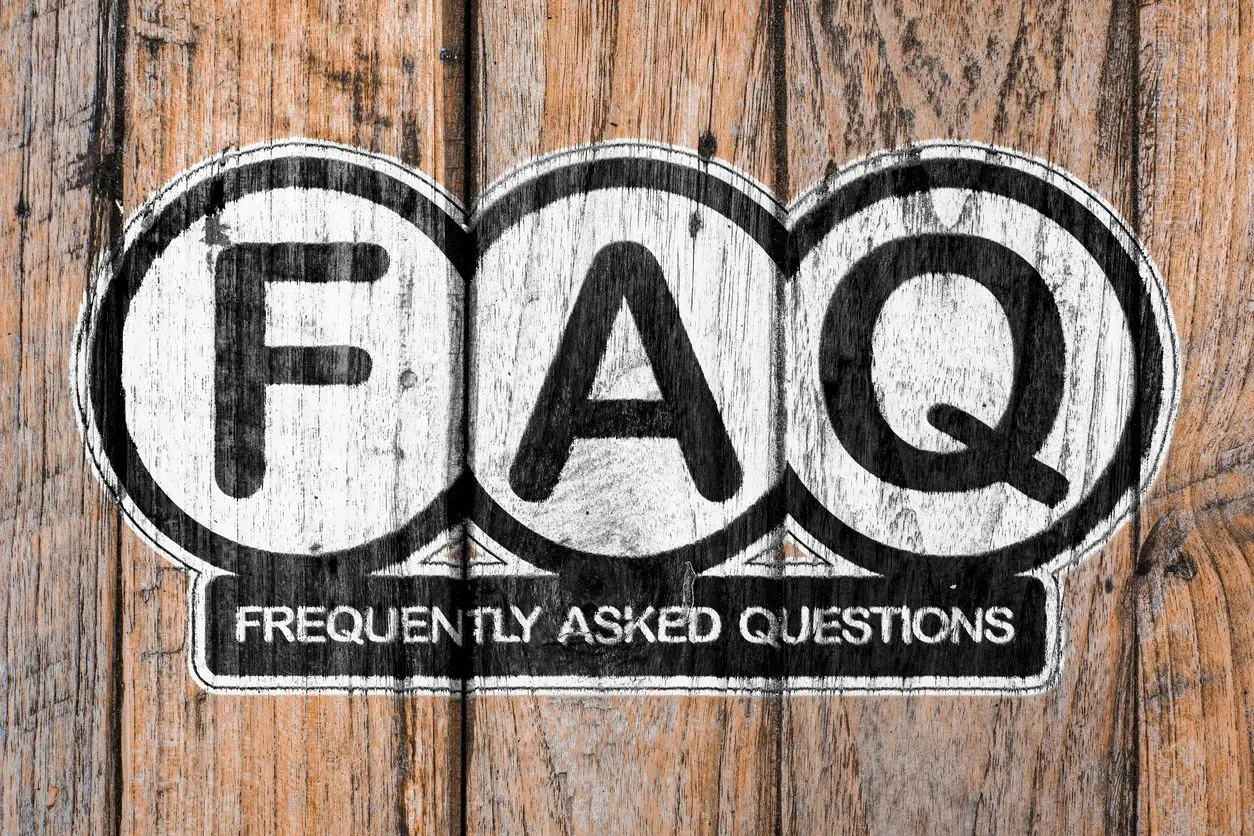 FAQ stencil painted on rustic wooden boards