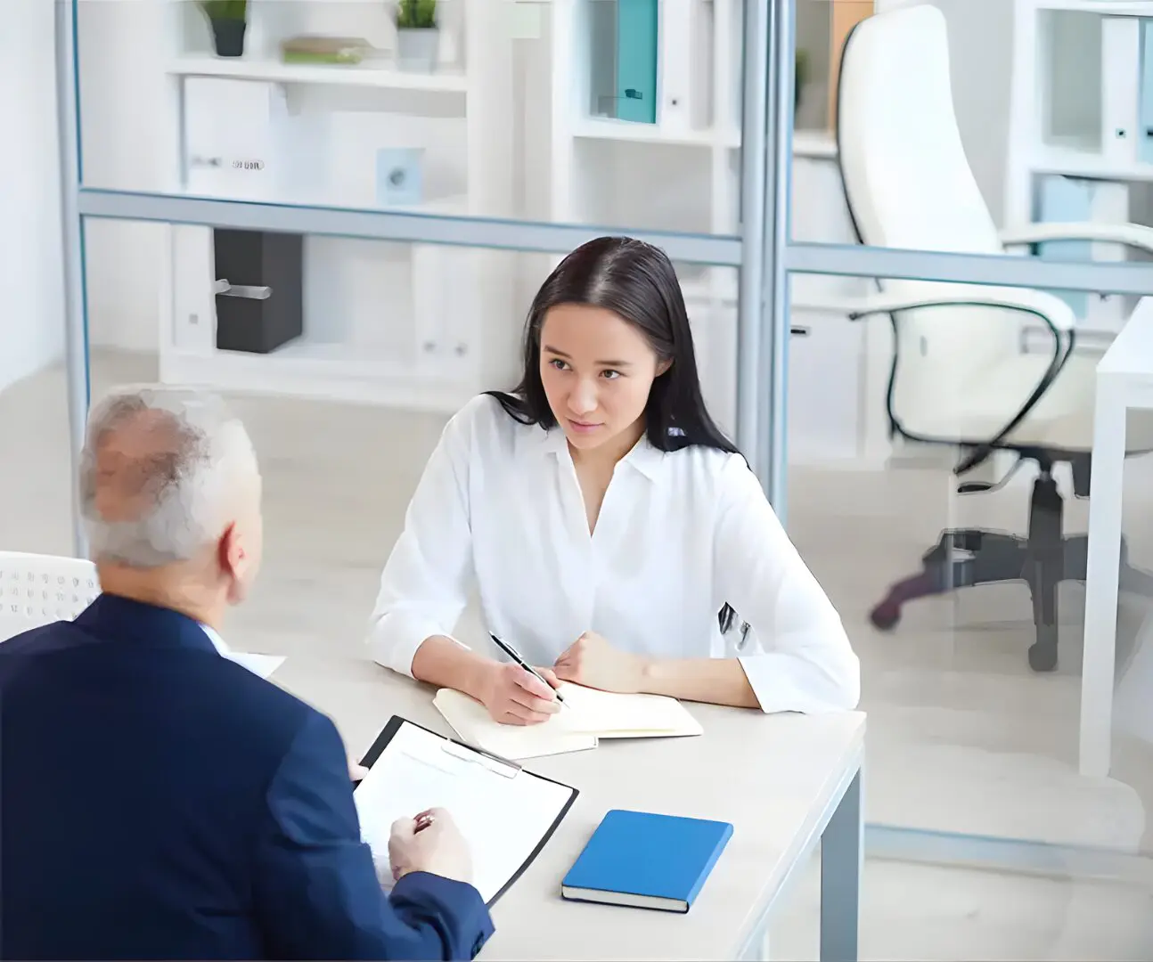 Woman in job interview across office desk